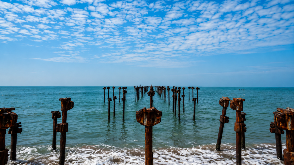 Alappuzha Beach and historic pier at sunset in Kerala