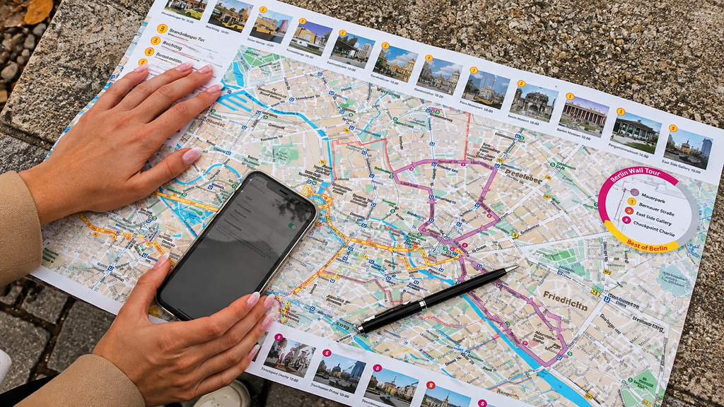 Solo traveler planning a trip with a map and phone