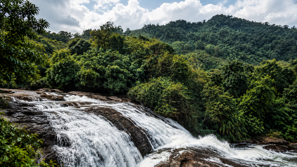 Adyanpara Waterfalls surrounded by tropical greenery in Malappuram Kerala
