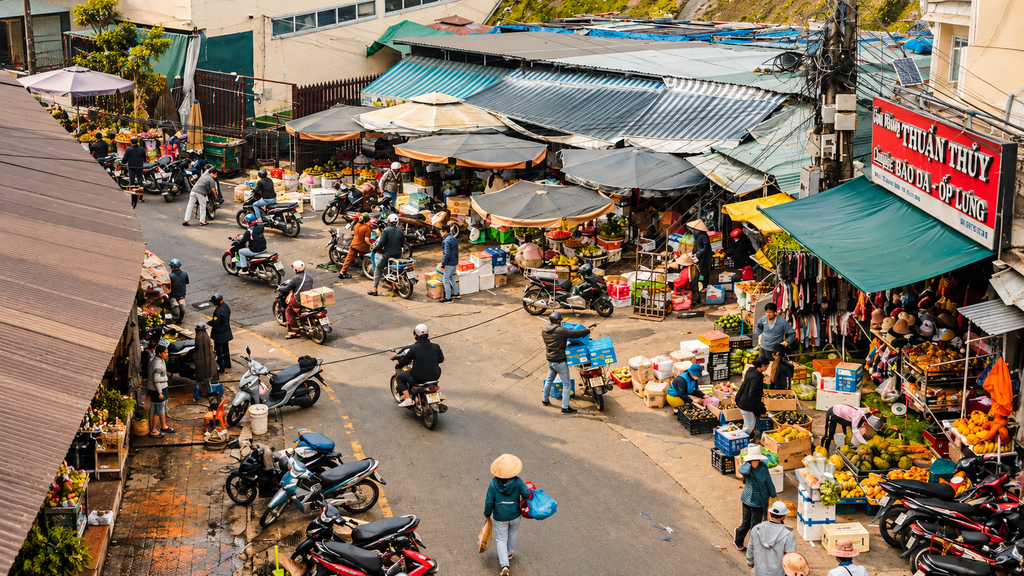 Busy local street in Vietnam with food stalls