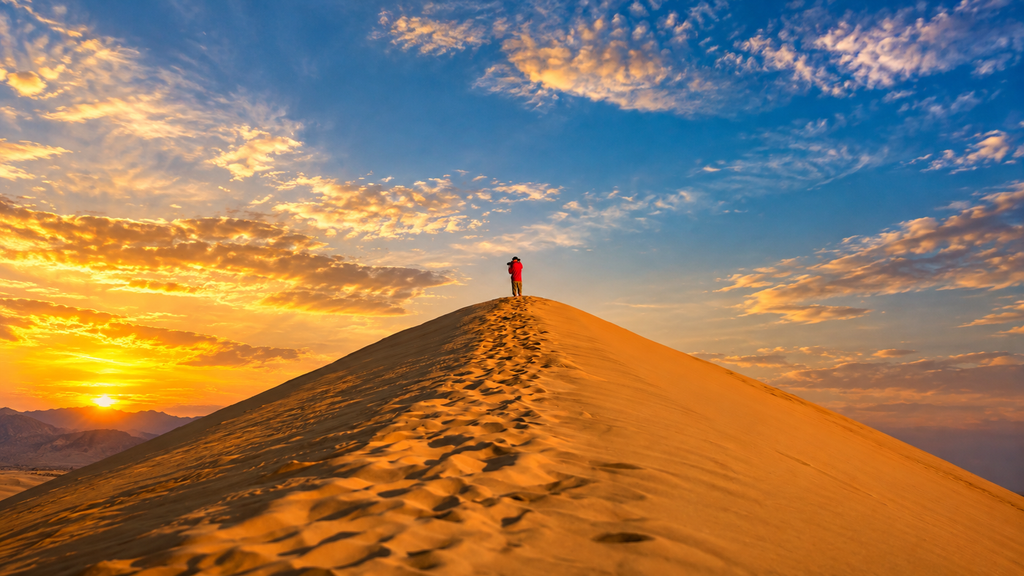 Golden A’Sharqiyah Sands desert dunes at sunset in Oman
