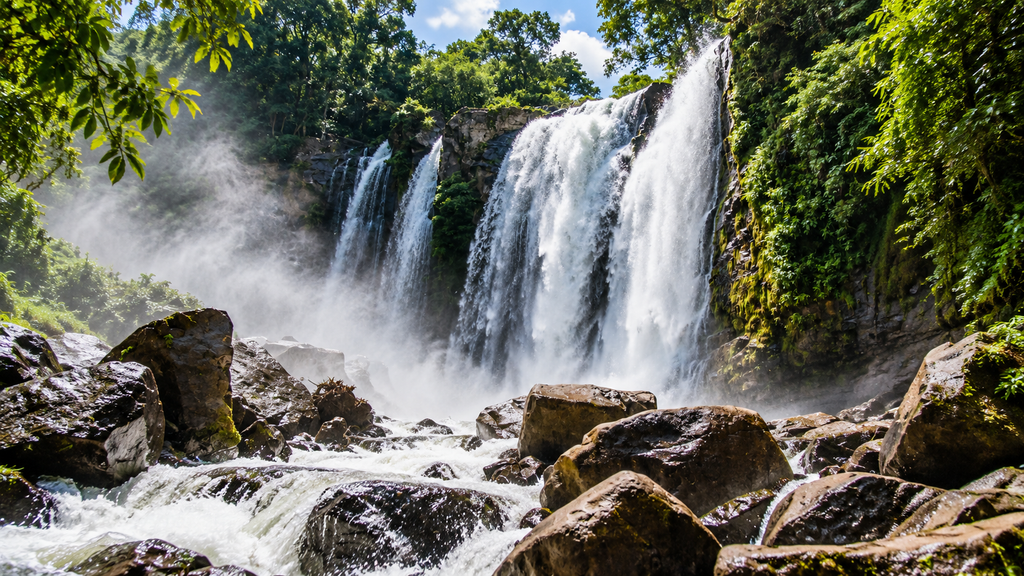  Perunthenaruvi Waterfalls flowing across rocks in Pathanamthitta Kerala
