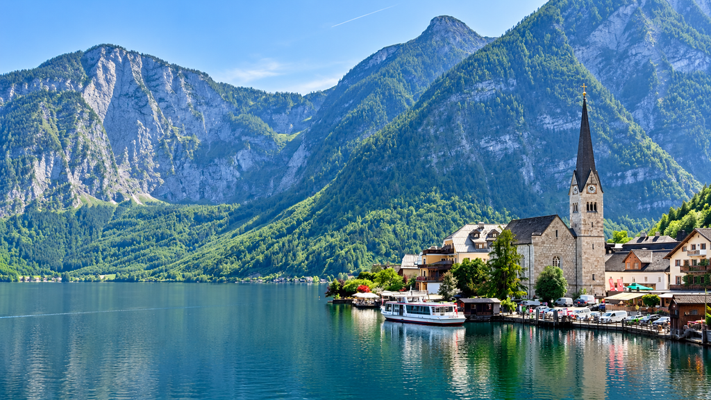 Scenic mountain road beside an alpine lake in Austria
