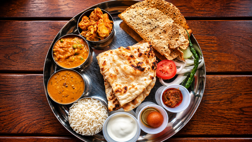 Traditional Indian thali with colorful dishes

