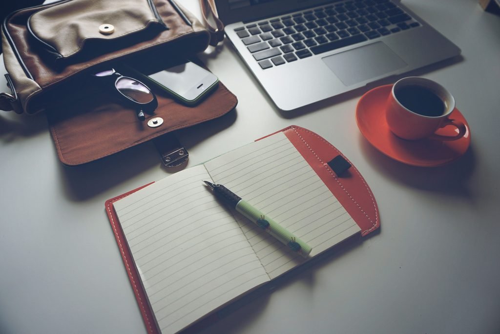 Traveler planning a flight itinerary on a laptop
