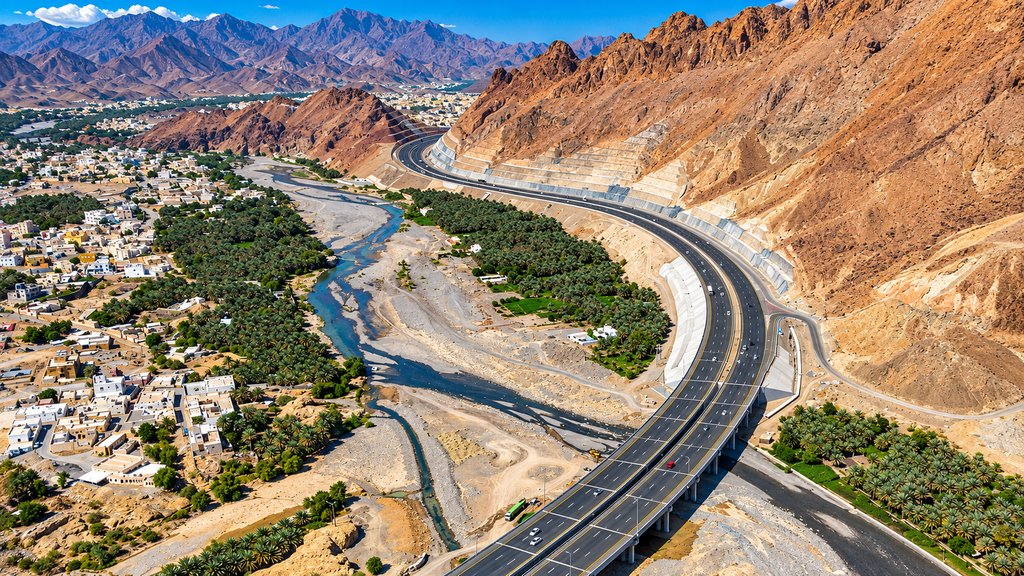 Empty road through the mountains and desert of Oman